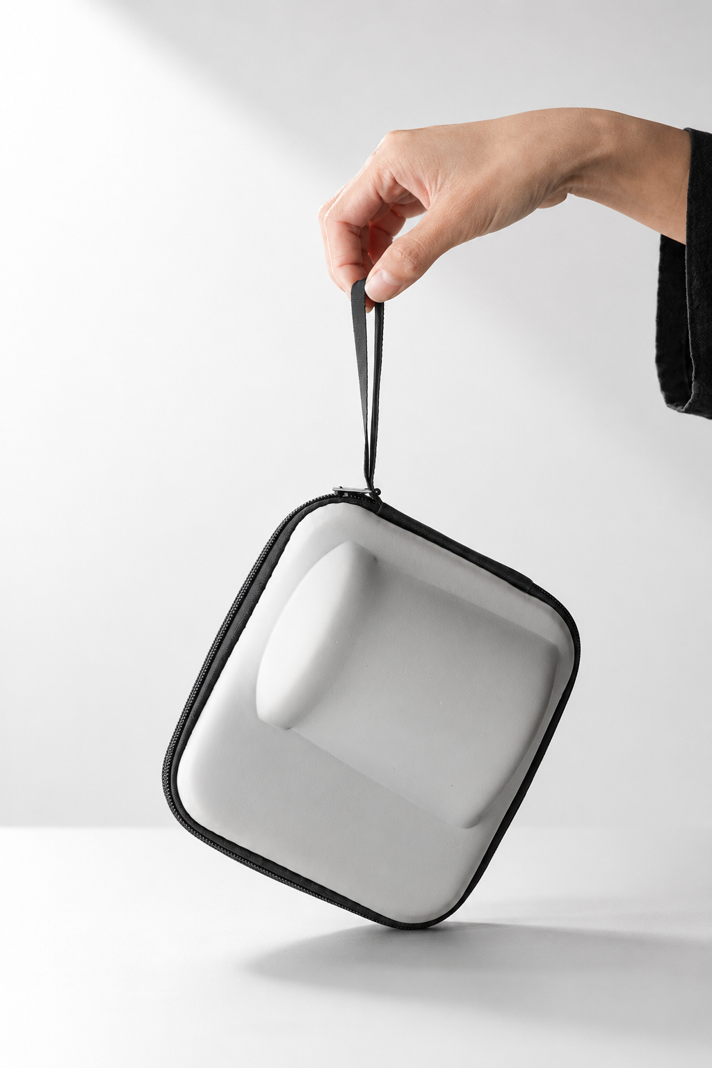 A fitted zip carrying case for a portable ceramic tea set